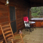 Covered Front Porch with Rocking Chairs and Hot Tub